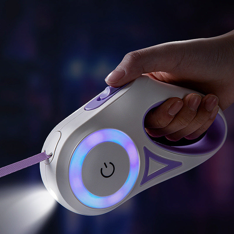 LED retractable dog leash glowing at night with the front torch switched on