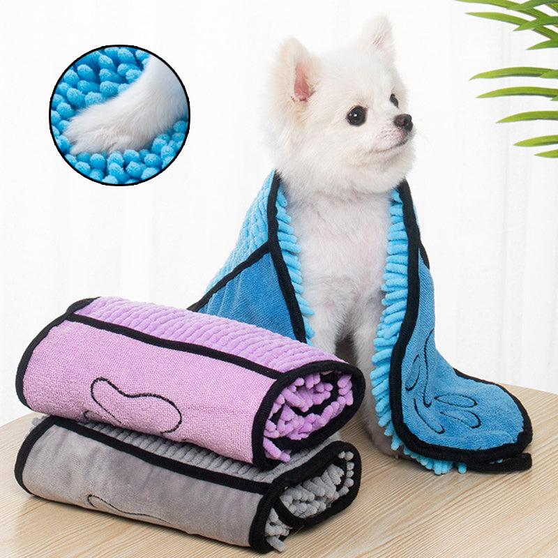 Small dog wrapped in a blue chenille microfibre pet drying towel