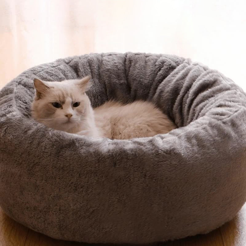Long plush donut dog bed with raised rim