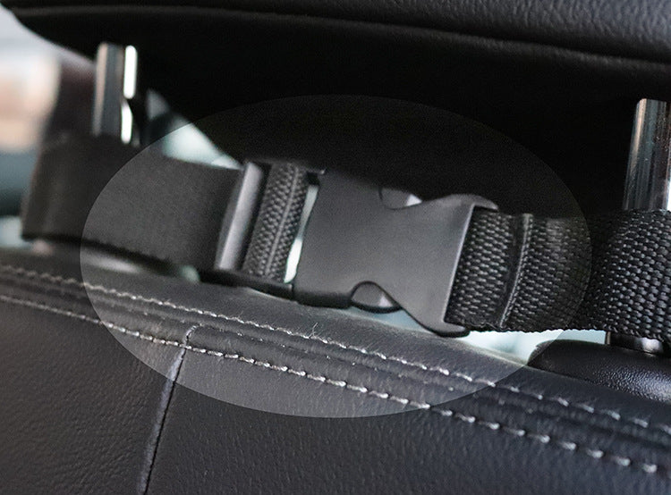 Close-up of the MATERA PET seat cover headrest strap and quick-release buckle