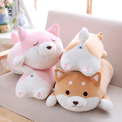 Chubby Shiba Inu plush pillow in brown and pink, group shot on armchair
