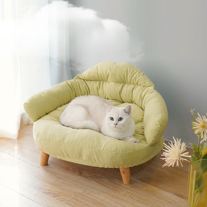 Elevated solid wood cat bed raised off the floor