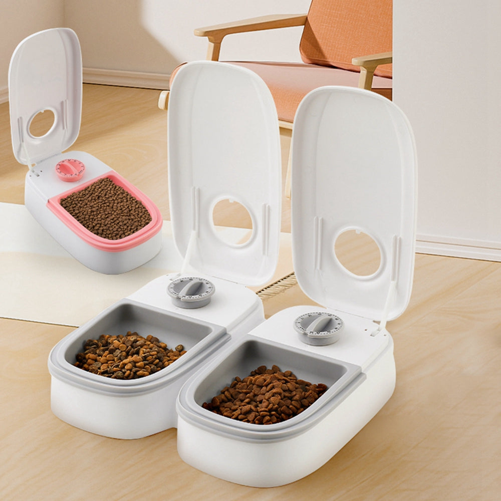 Three MATERA PET timed feeders open with kibble in the removable meal trays