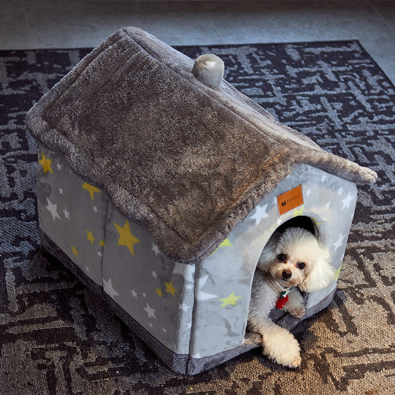 White poodle resting in the grey star pet house on a rug