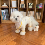 MATERA PET cream knit four-leg jumpsuit sweater worn by a small white dog