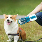 Corgi on grass next to a MATERA PET 3-in-1 dog water bottle held by its owner