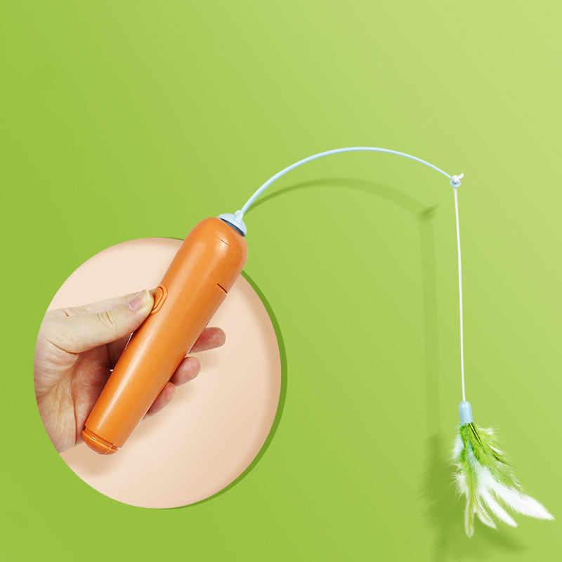 Hand holding the spring feather wand of the cat turntable toy