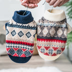 Navy and cream MATERA PET Nordic dog sweaters held up side by side