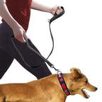 Owner walking a tan dog on the MATERA PET double-handle reflective nylon leash