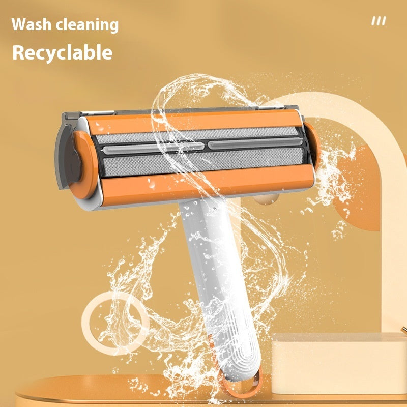 The pet hair roller head being rinsed clean under running water
