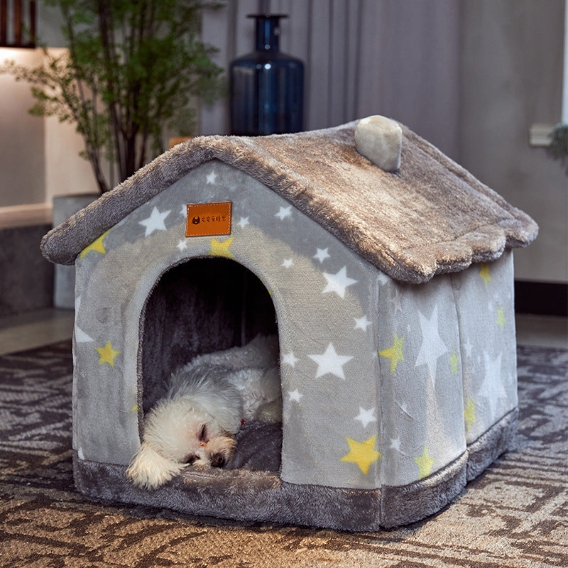 Small dog asleep inside the grey star foldable pet house