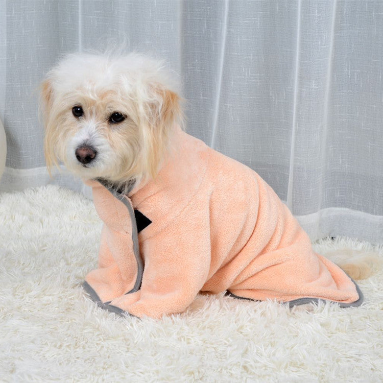 Dog resting on a rug in the peach quick-dry drying robe