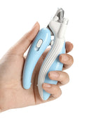 Hand gripping the non-slip handle of the blue LED Pet Nail Clippers