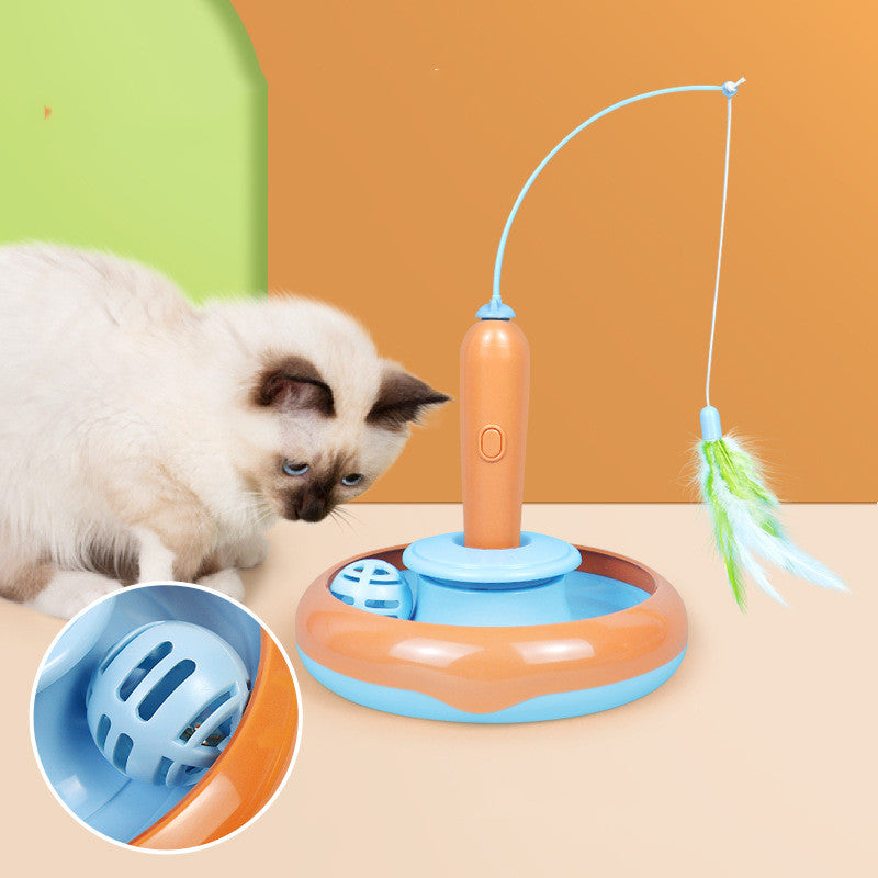 Cat playing with the rolling ball track of the turntable toy