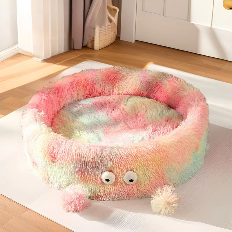 Cat curled up inside the round monster nest