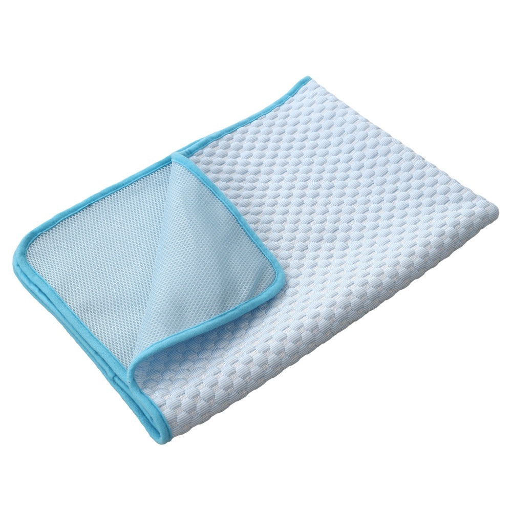 Green cooling gel pad shown inside a dog crate