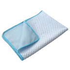 Green Pet Cooling Gel Mat shown inside a dog crate